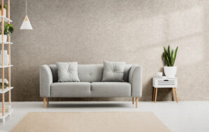Poster,Above,White,Cabinet,With,Plant,Next,To,Grey,Sofa